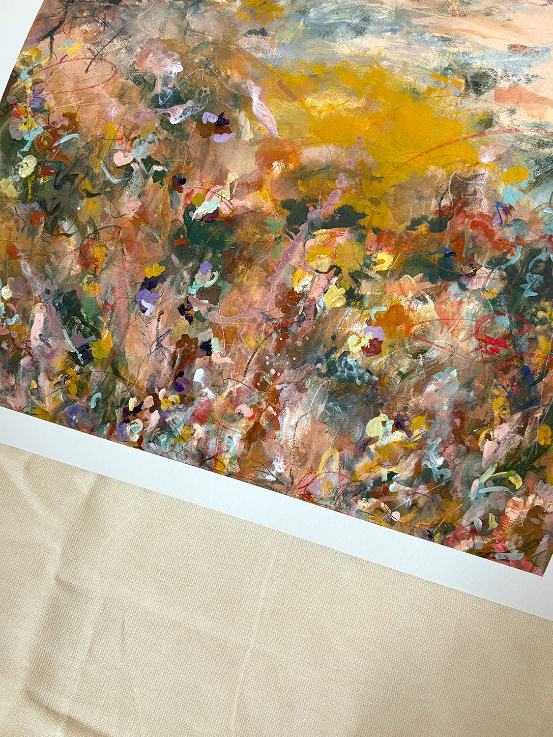 Close-up of abstract art print with warm, vibrant colours.