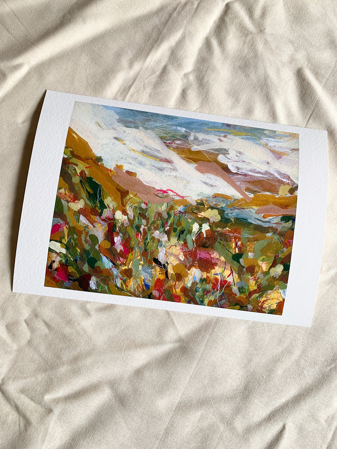 Abstract art print with vibrant colours on a textured surface.