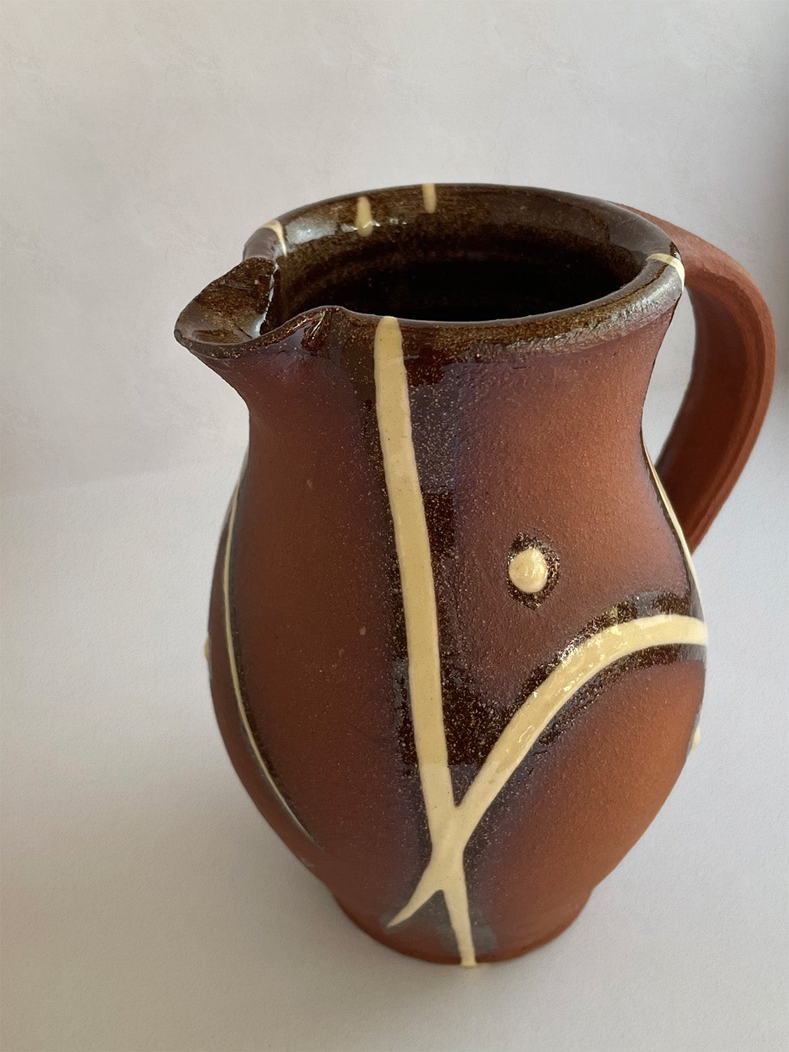 Handmade slipware small jug - detail.
