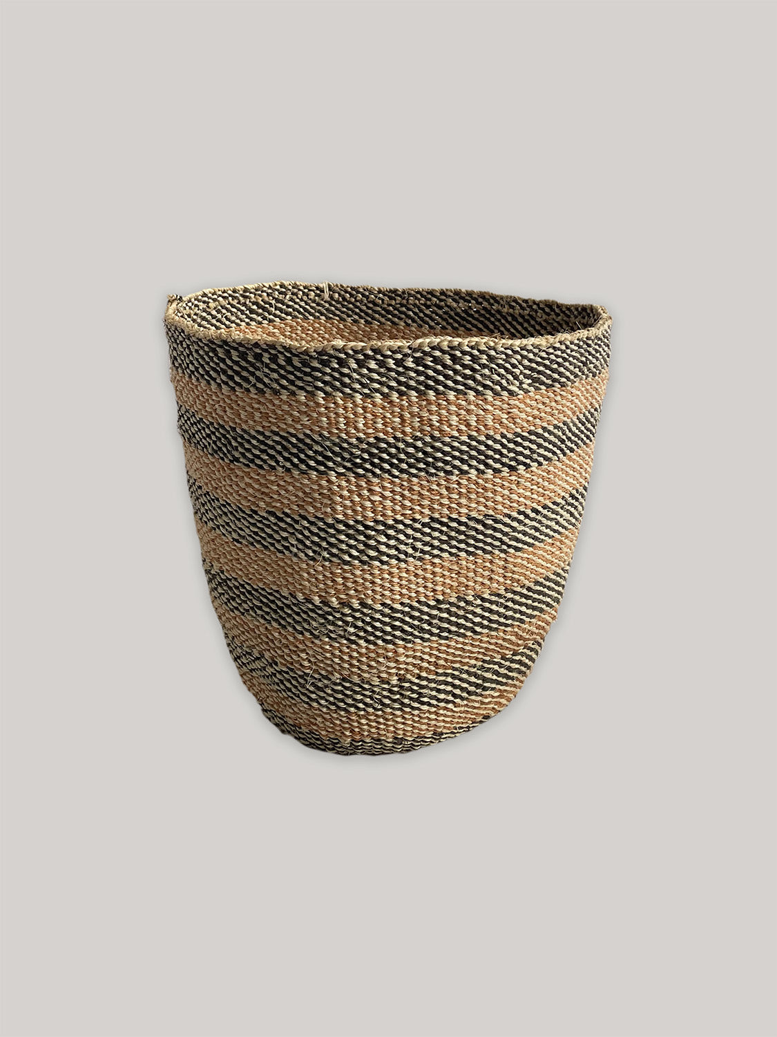 Medium handwoven sisal basket in black and natural - front.