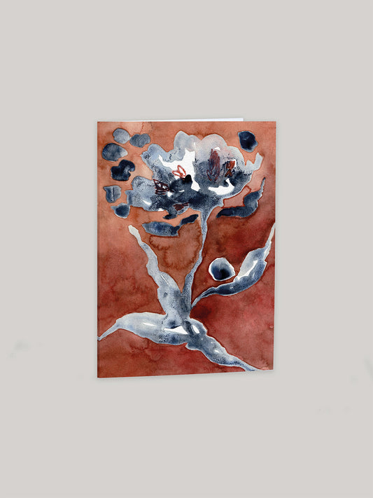 Greetings card with abstract floral design on an earthy red background.