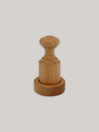 Beech paper pot press on a neutral background.