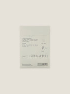Back of Cornflower seed packet with text and growing instructions on a neutral background.