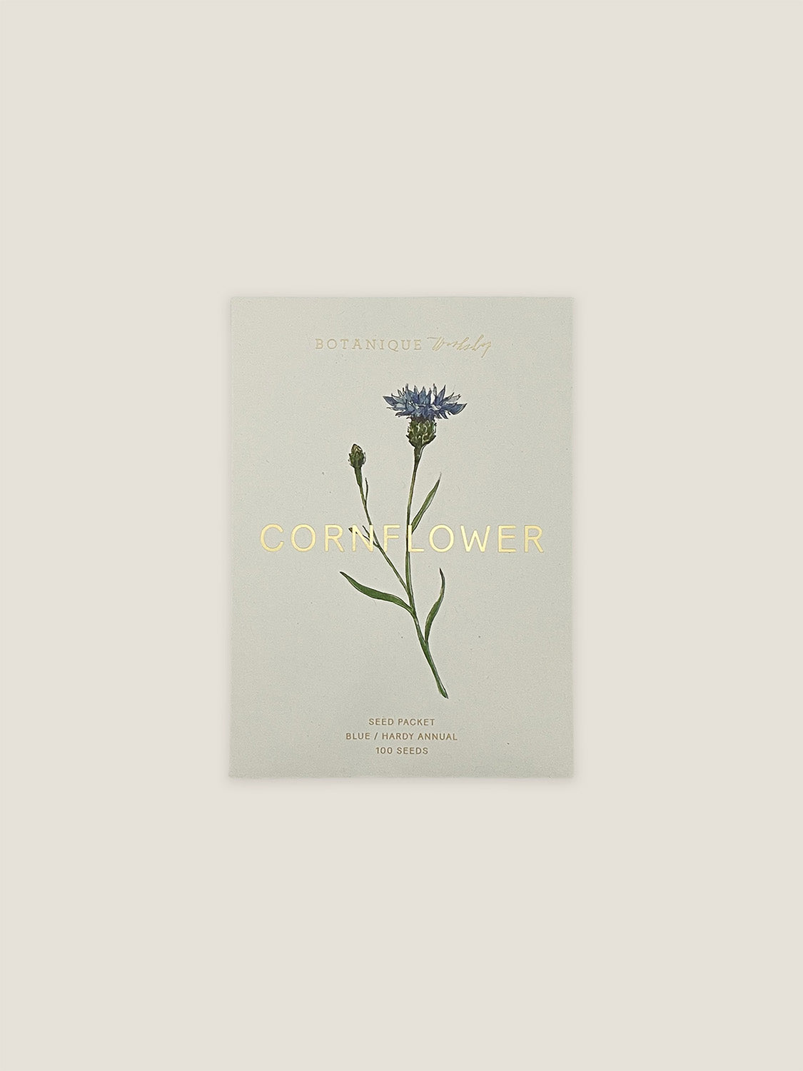 Cornflower seed packet with botanical illustration on a neutral background.