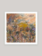 Abstract art print with warm colours in white frame on a neutral background.