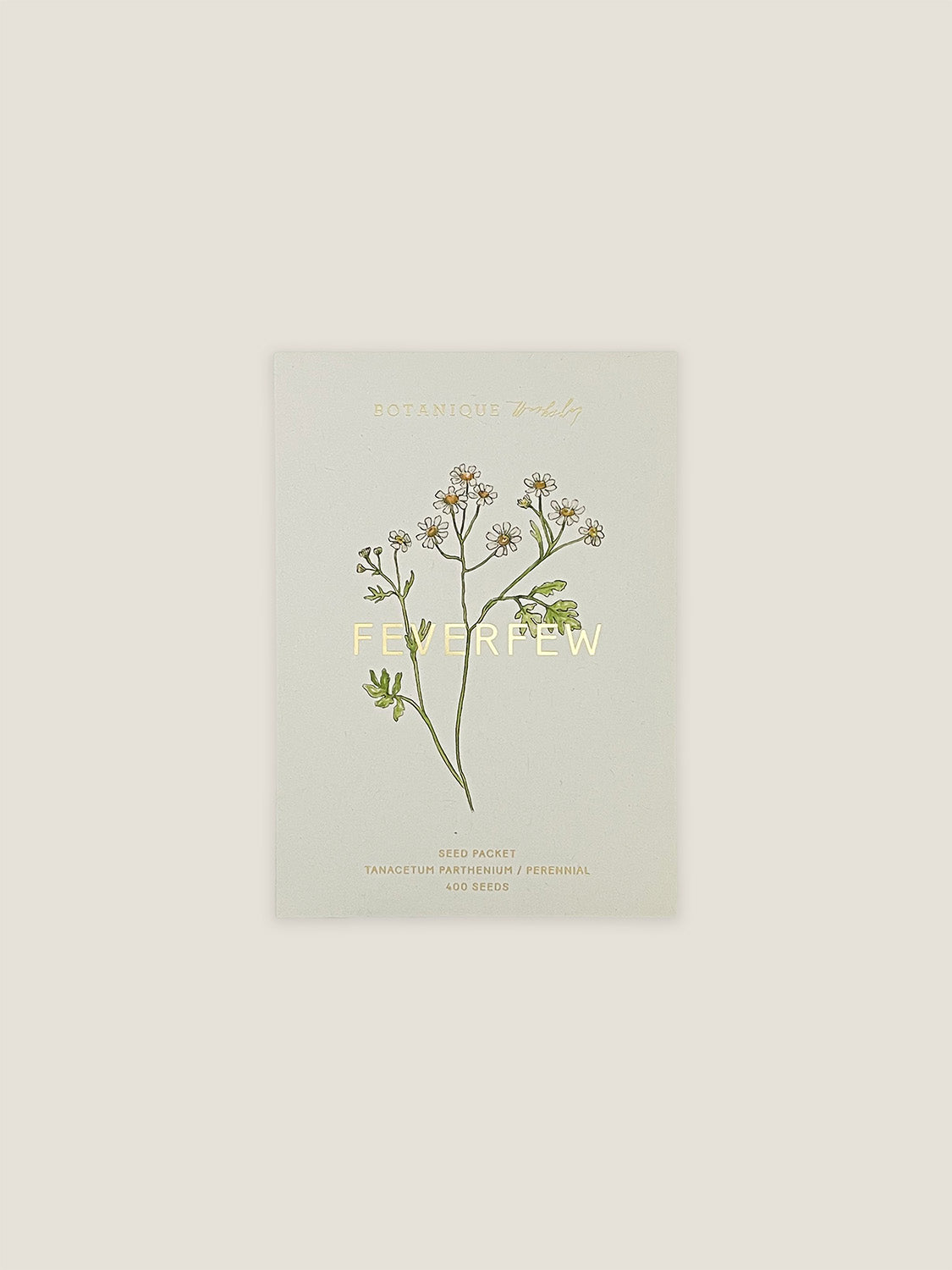 Feverfew seed packet with botanical illustration on a neutral background.