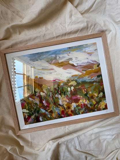 Framed abstract art print with vibrant colours on a textured surface.