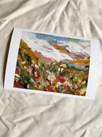 Abstract art print with vibrant colours on a textured surface.
