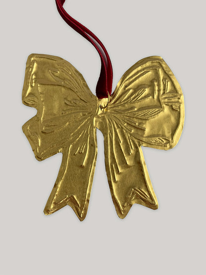 Gold tin bow handmade Christmas decoration with red velvet ribbon - detail.