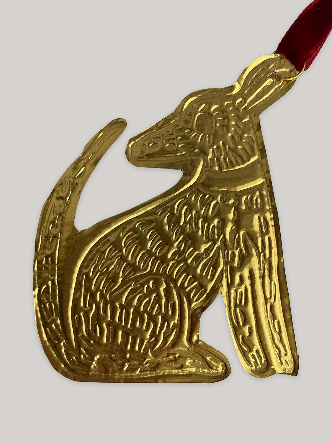 Gold tin dog handmade Christmas decoration with red velvet ribbon - back.