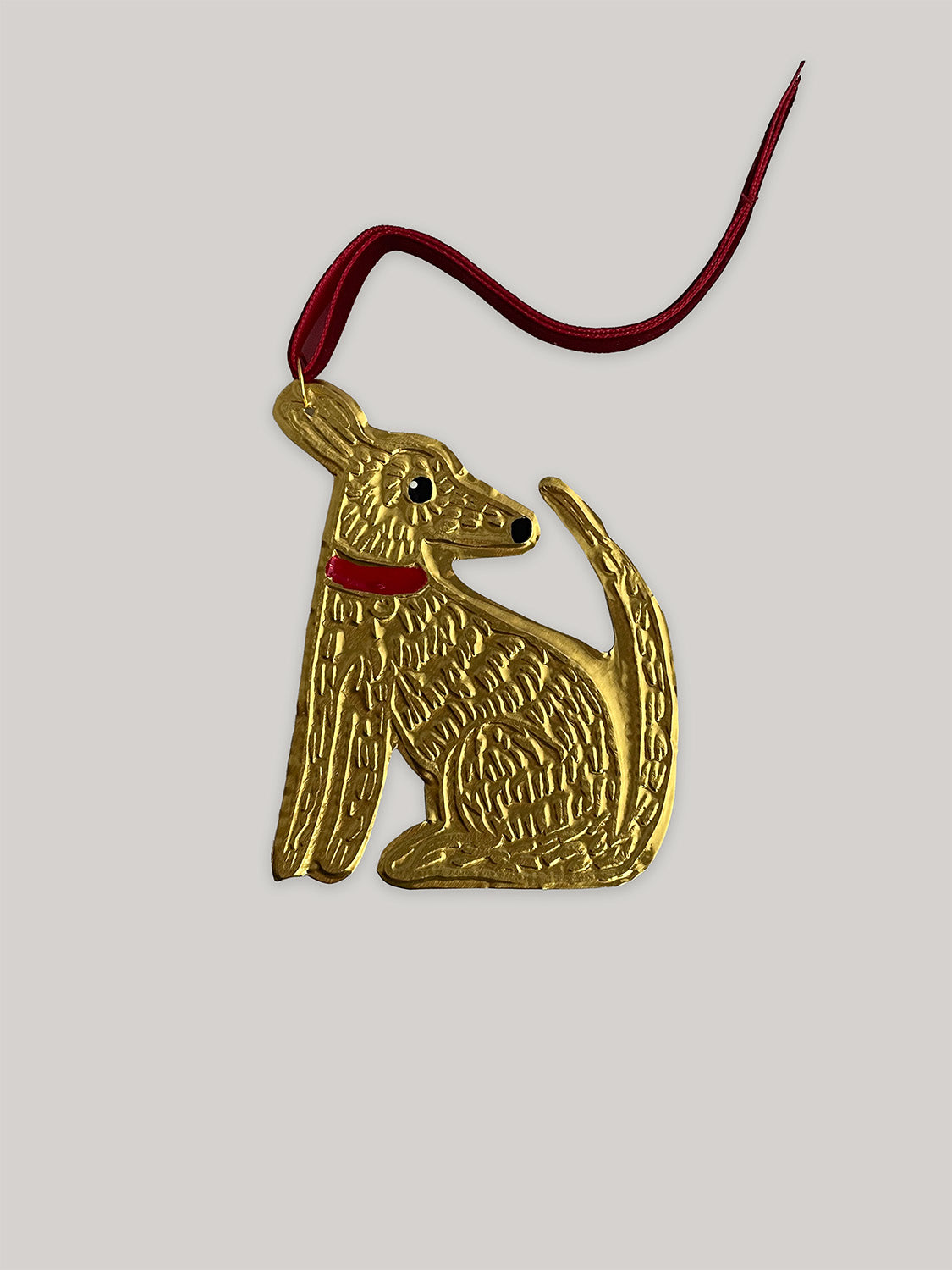 Gold tin dog handmade Christmas decoration with red velvet ribbon - front.