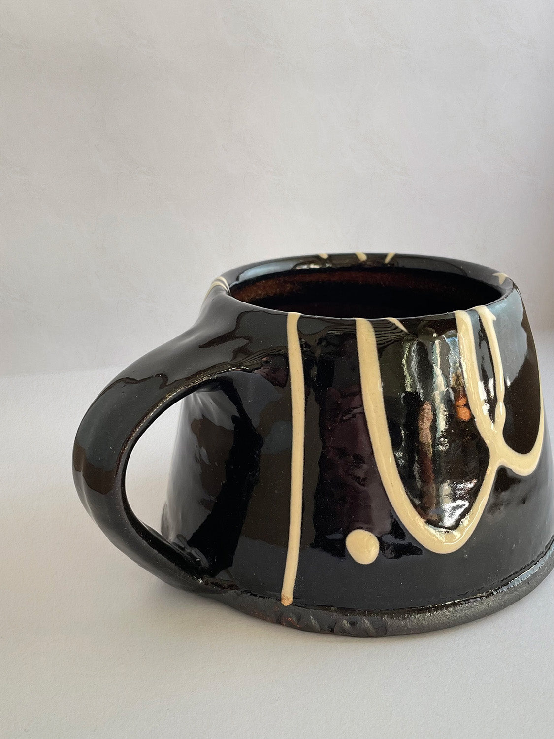 Handmade slipware mug - back detail.