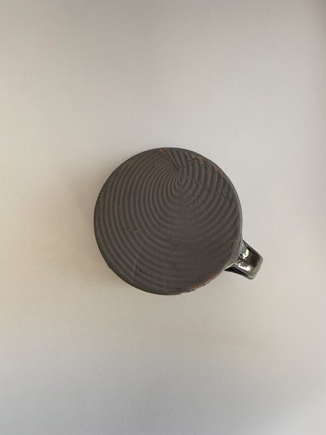 Handmade slipware mug - base.