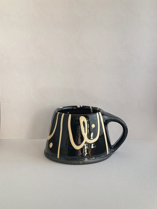 Handmade slipware mug - left.