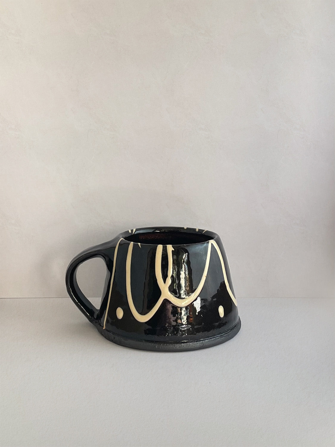 Handmade slipware mug - right.