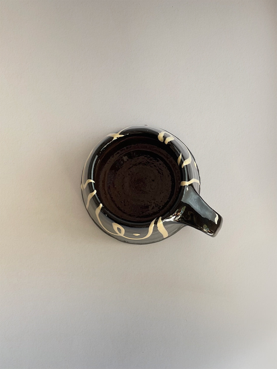 Handmade slipware mug - top.