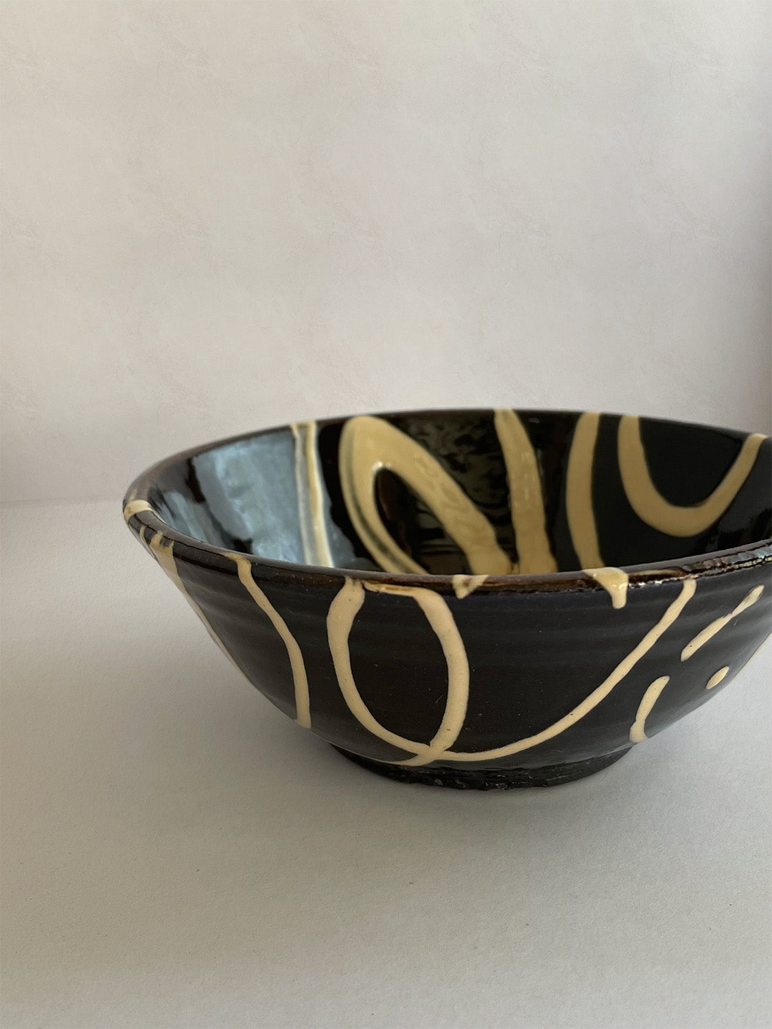Handmade slipware small bowl - front detail.
