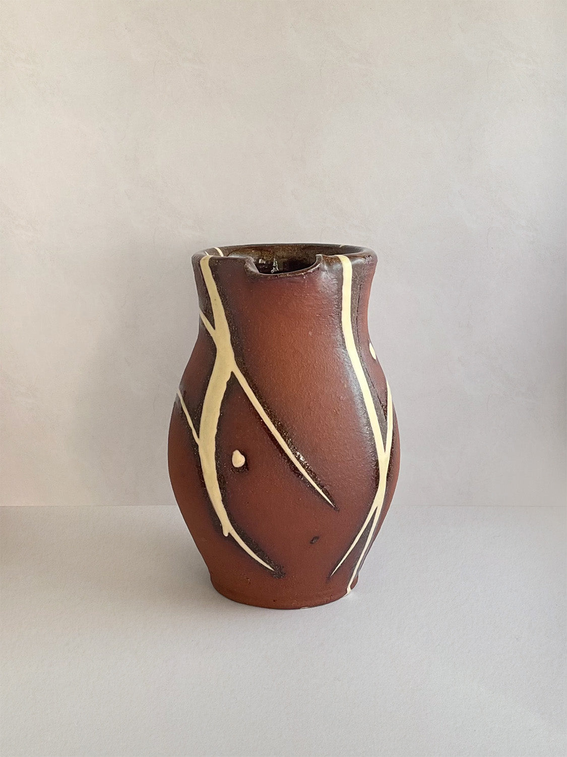 Handmade slipware small jug - front.