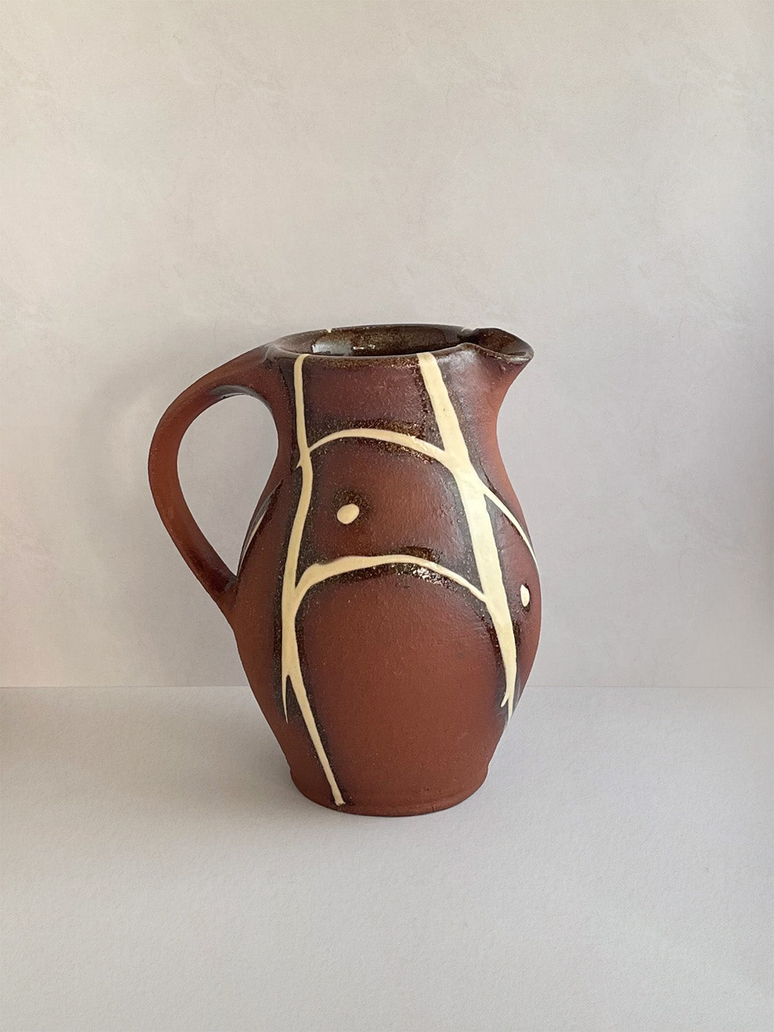 Handmade slipware small jug - right.