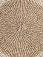Close-up of round handwoven sisal placemat.