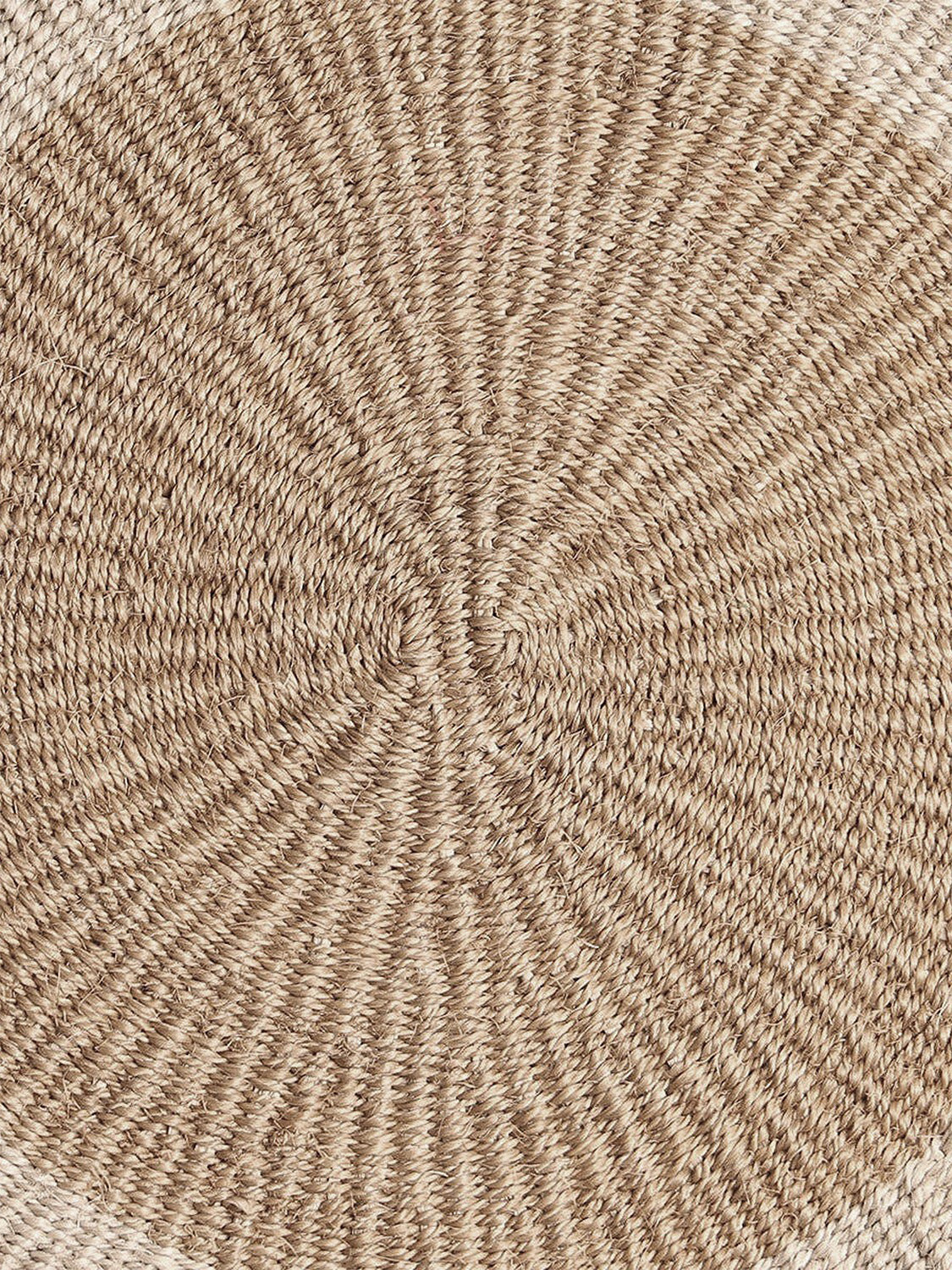Close-up of round handwoven sisal placemat.