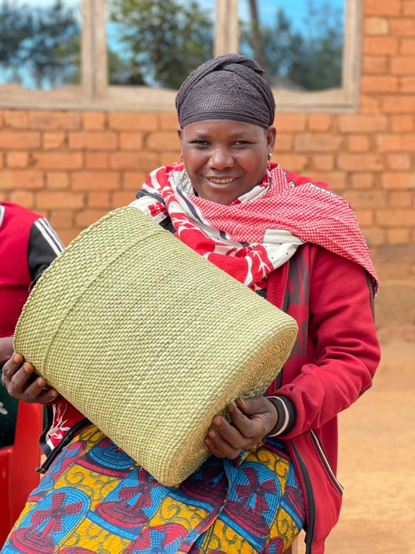 Weaver of handwoven storage baskets.