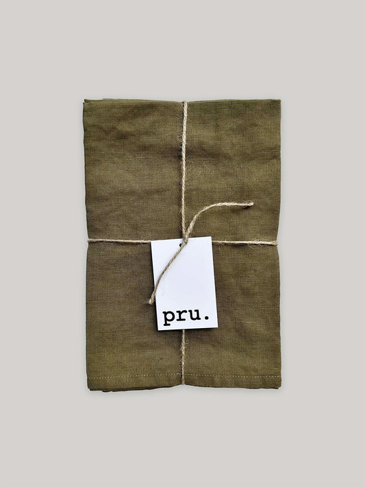 100% linen napkin set, khaki green, with 'pru' label on a neutral background.