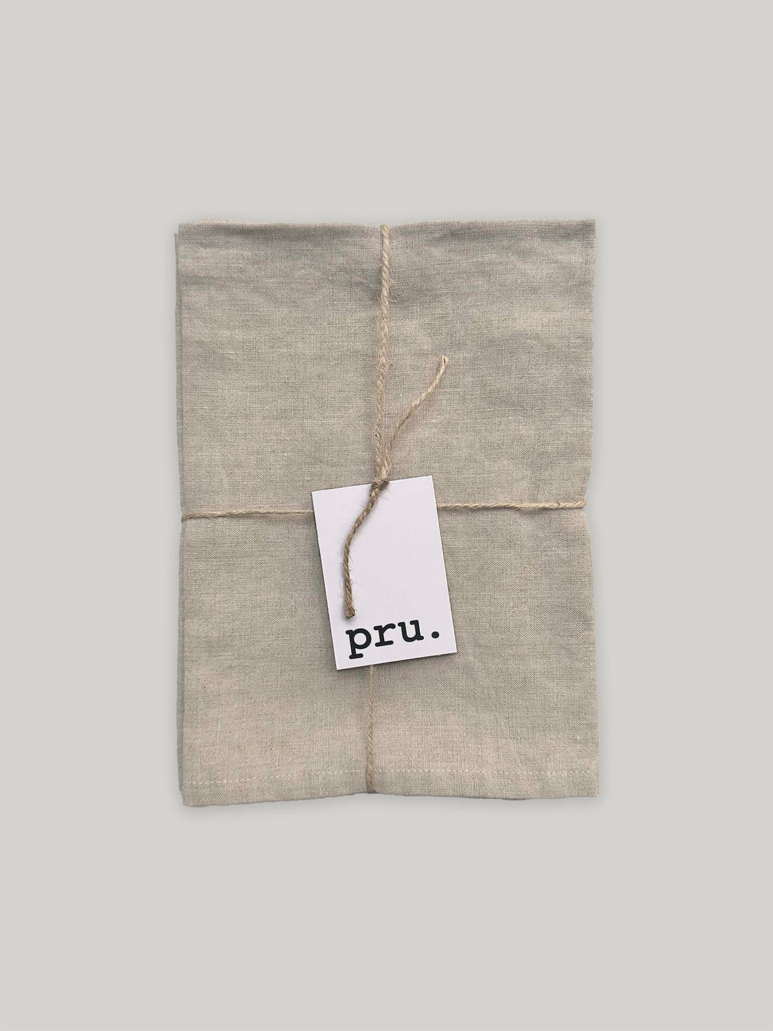 100% linen napkin set, natural colour, with 'pru' label on a neutral background.