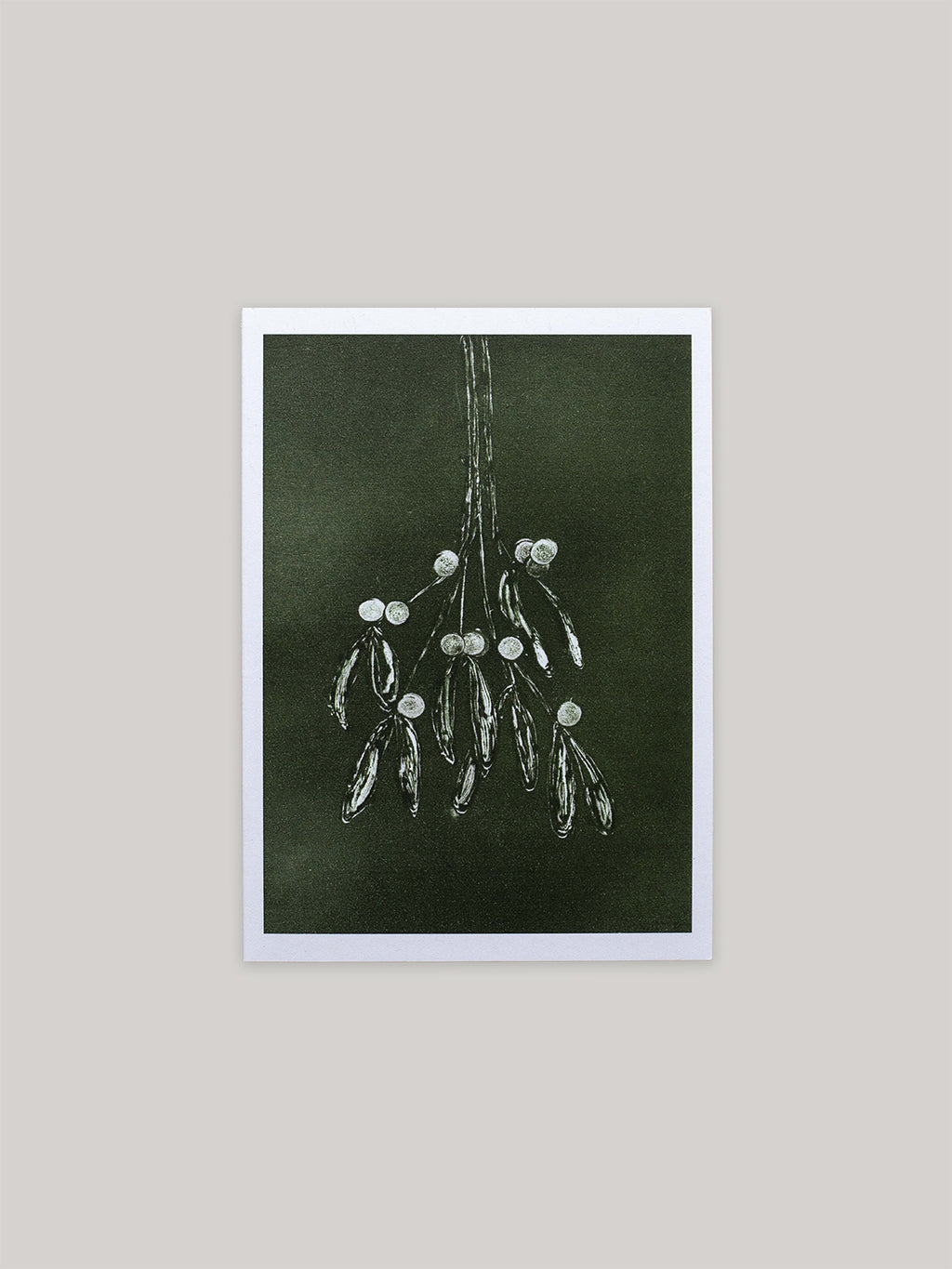 Botanical Christmas card with mistletoe design on a dark green background.