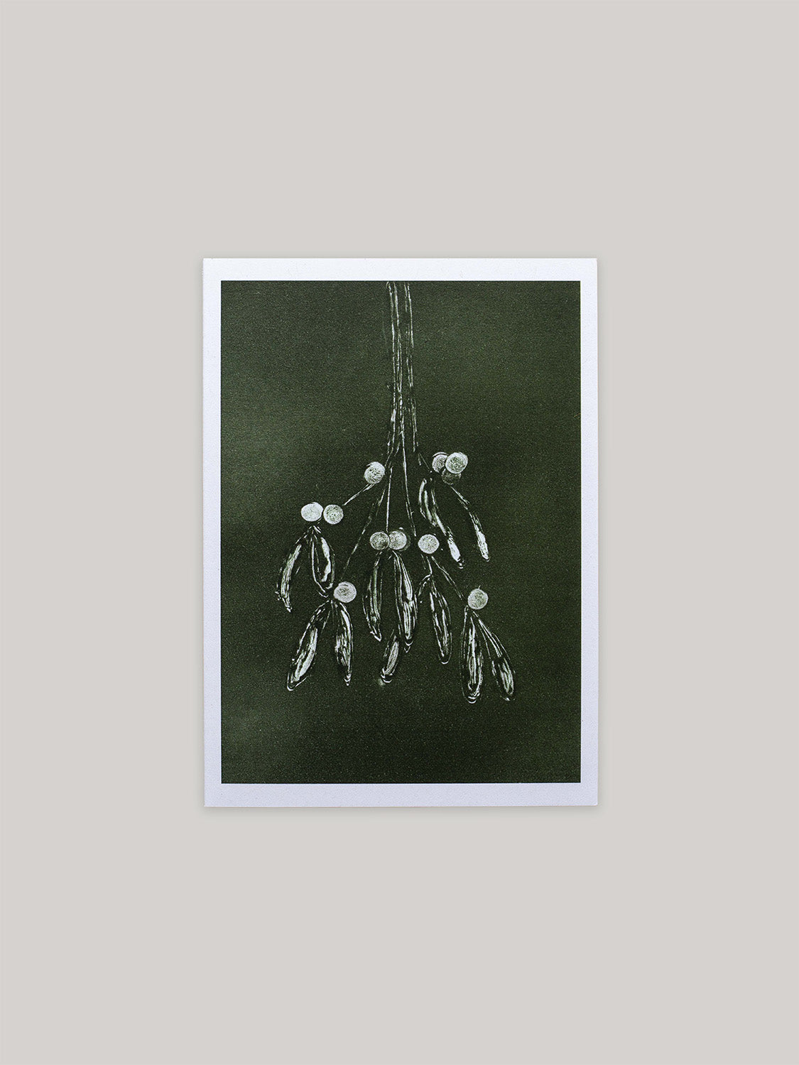 Botanical Christmas card with mistletoe design on a dark green background.