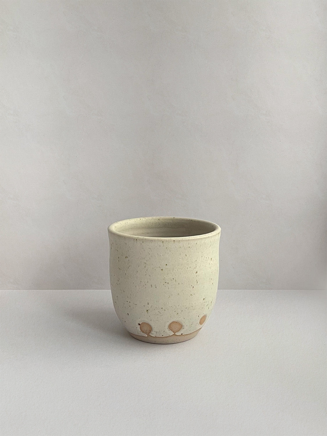 Oat Speckle ceramic coffee cup - front.