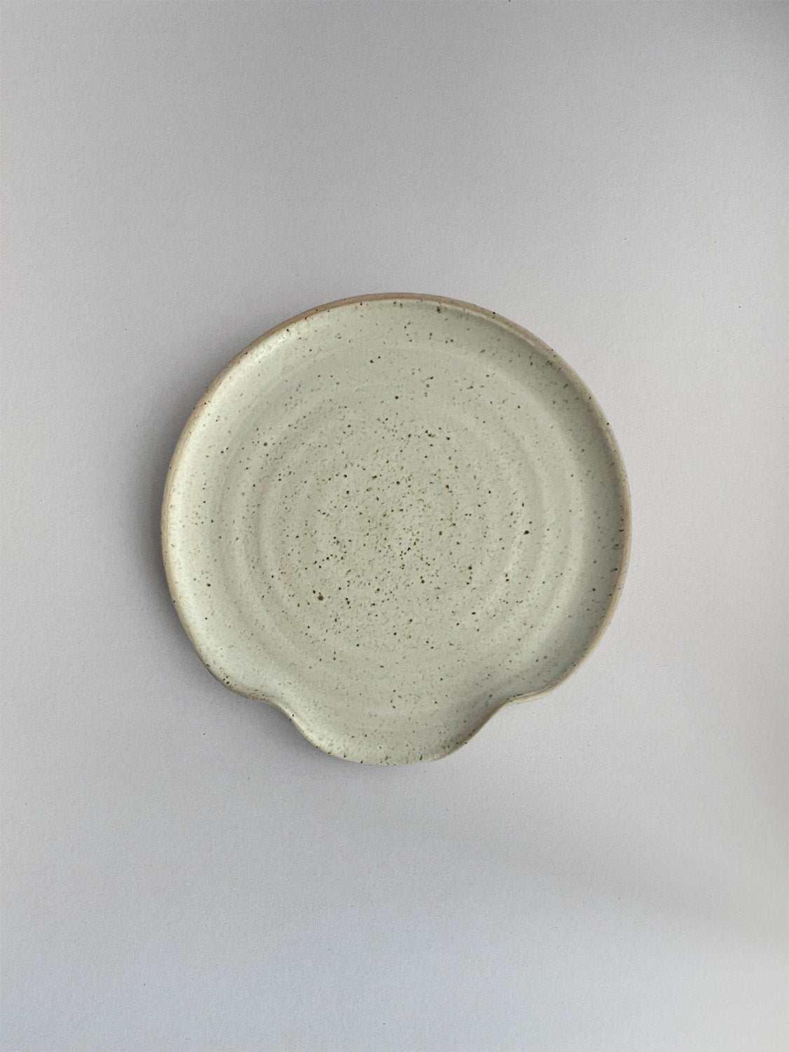 Oat Speckle ceramic spoon rest - top.