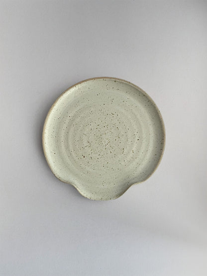 Oat Speckle ceramic spoon rest - top.