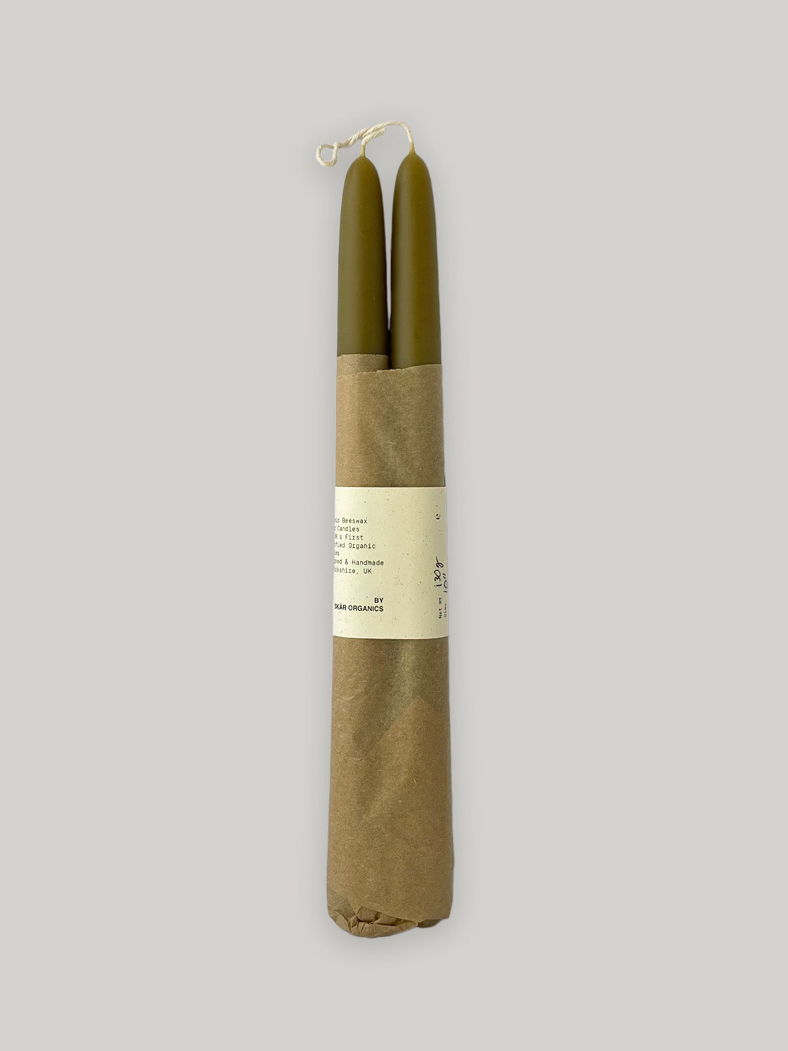 Pair of organic beeswax and green tea hand-dipped taper candles - front.