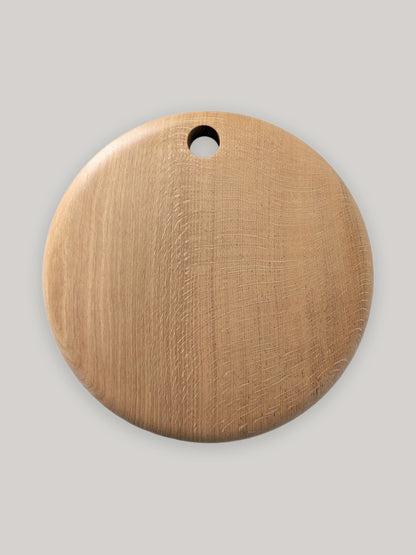 Large round wooden serving board in English Oak - top.