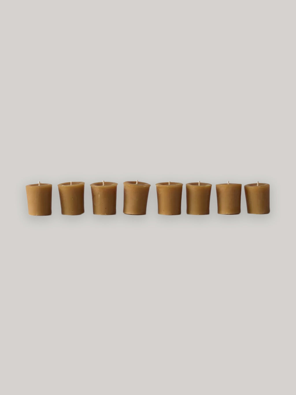 Set of 8 organic beeswax hand-poured votives - front.