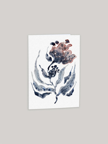 Greetings card with watercolour floral design on a neutral background.