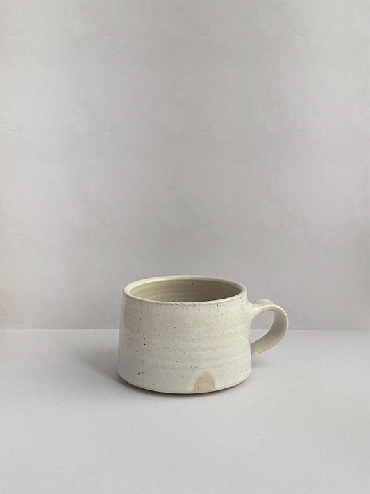 Warm White Speckle ceramic espresso mug - front.