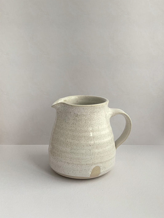 Warm White Speckle ceramic jug - front.