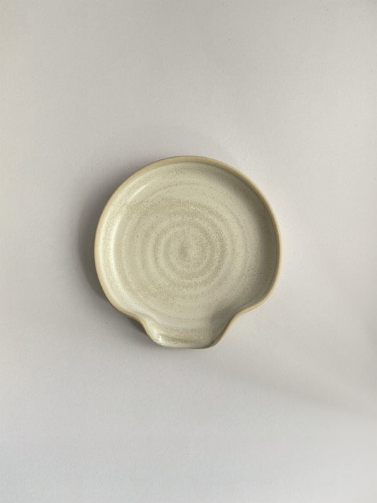 Warm White Speckle ceramic spoon rest - top.