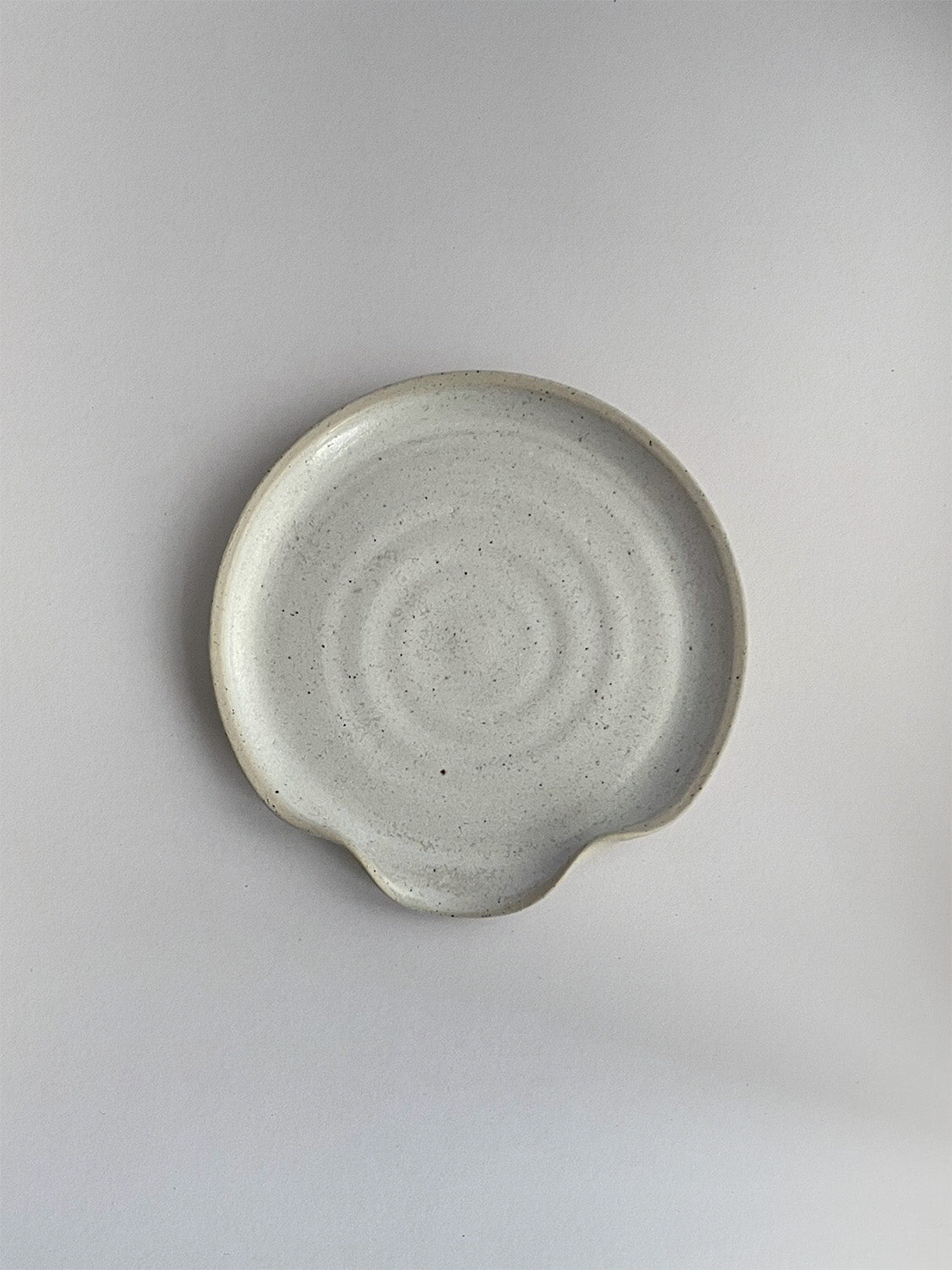 Warm White Speckle ceramic spoon rest - top.