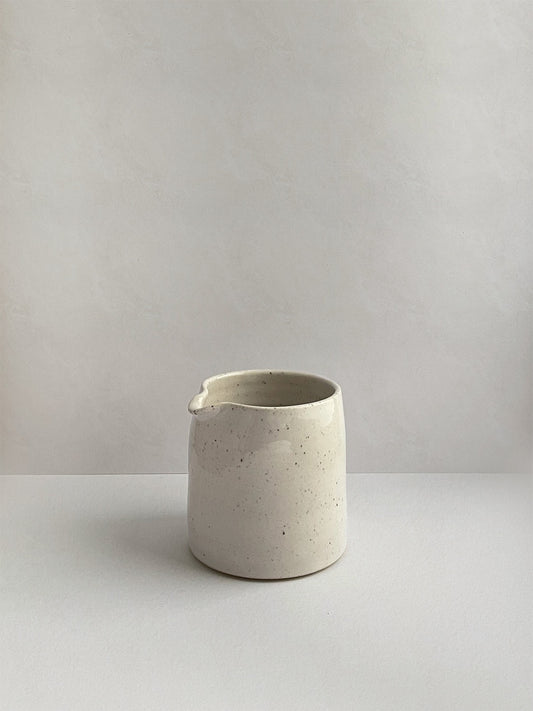 White Speckle ceramic milk jug - front.