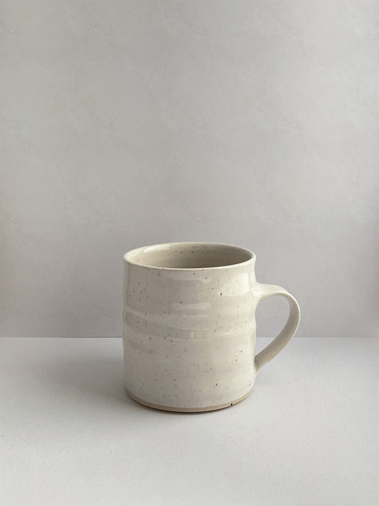 White Speckle ceramic mug - front.