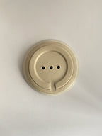 Ceramic soap dish on a neutral background - base view.