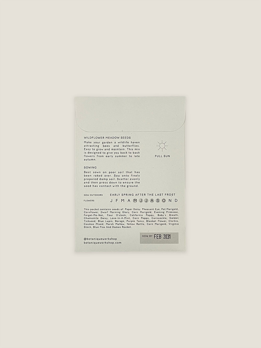 Back of Wildflower Meadow seed packet with text and growing instructions on a neutral background.