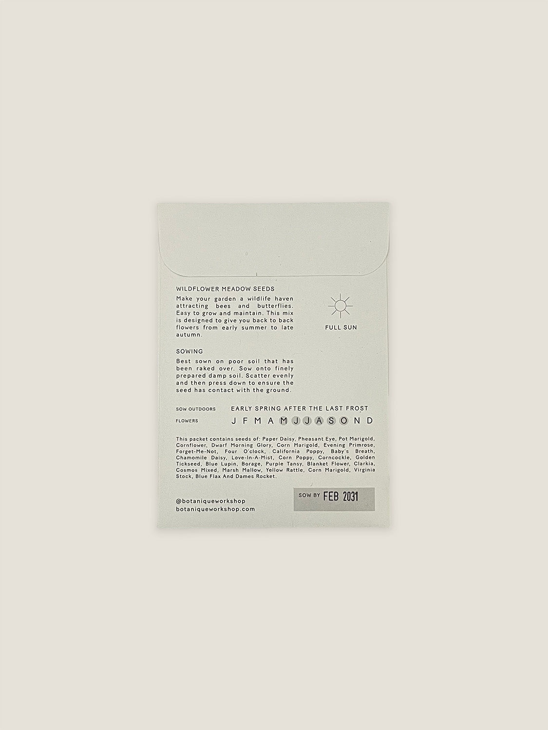 Back of Wildflower Meadow seed packet with text and growing instructions on a neutral background.